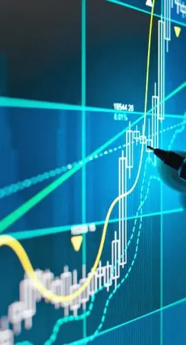 A hand pointing to a stock market graph on a digital screen indicating financial analysis.