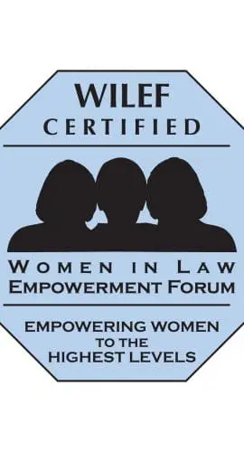 A blue octagonal emblem featuring the text "WILEF Certified - Women in Law Empowerment Forum - Empowering Women to the Highest Levels" along with silhouettes of three women.