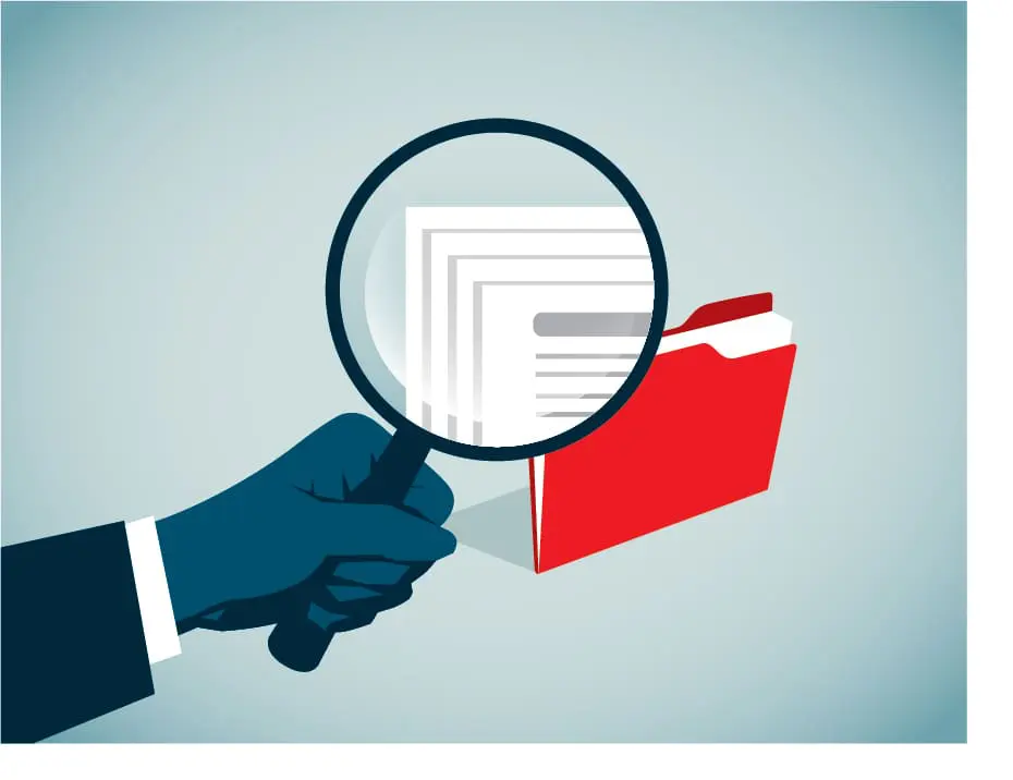 A magnifying glass is being held over a folder with papers, emphasizing scrutiny or examination.