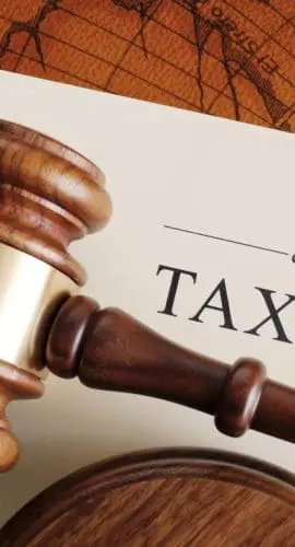 gavel atop a document titled "tax law"