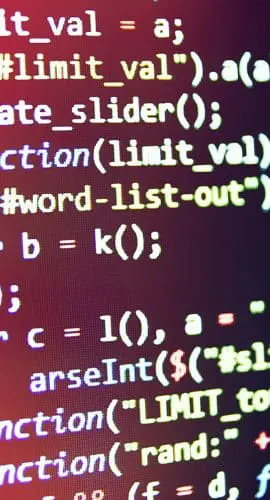A close-up of a computer screen displaying colorful programming code in a development environment.