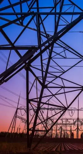 The Silhouette Of The Evening Electricity Transmission Pylon