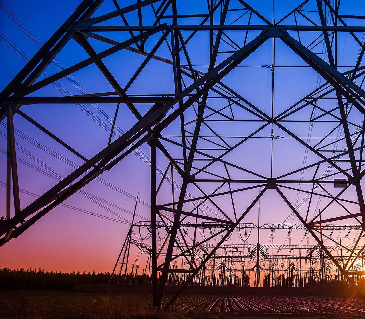 The Silhouette Of The Evening Electricity Transmission Pylon