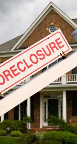 Foreclosure Sign In Front On Modern House