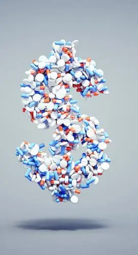 A dollar sign is formed by an assortment of various pills and capsules.