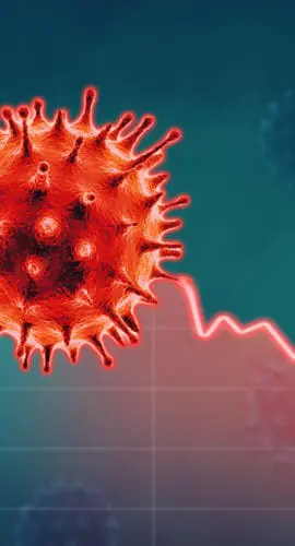 A red spiky virus is superimposed over a graph showing a sharp decline from green to red.