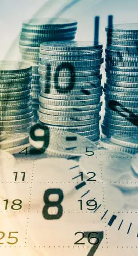 Stacks of coins are overlaid with the image of a clock.