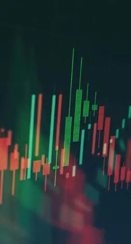 A fluctuating stock market graph with red and green candlestick patterns.