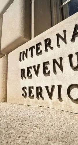 The front facade of a building displays a sign reading "Internal Revenue Service."