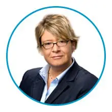 A person with short hair, glasses, and a suit jacket is shown within a blue circular frame.