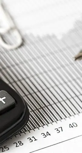 Calculator and pen on table