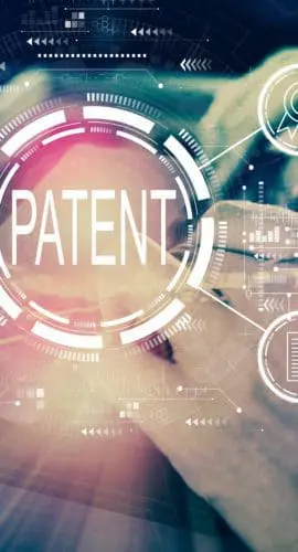 Patent concept with man using his tablet computer