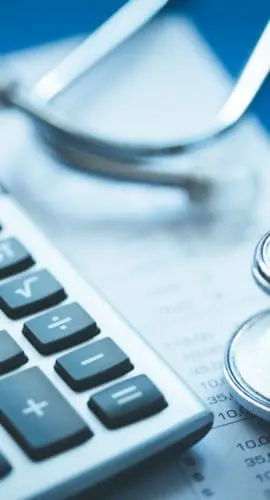 Stethoscope And Calculator Concept