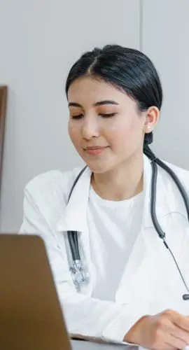 A woman looking at the screen