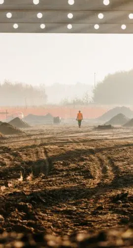 Frame structure at under construction site on rural landscape
