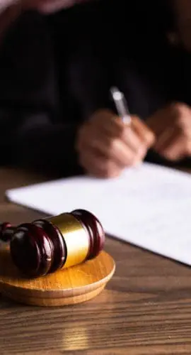 Judge signing on the papers