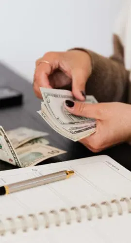 Person counting cash money