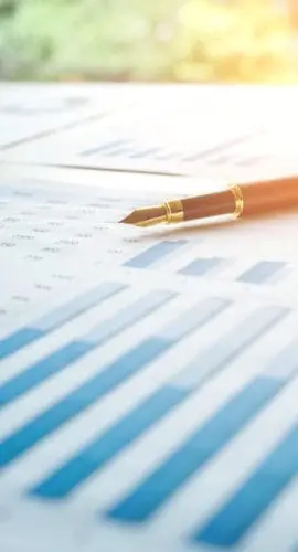 Pen  on the business paper. Report chart