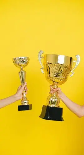 People holding trophies