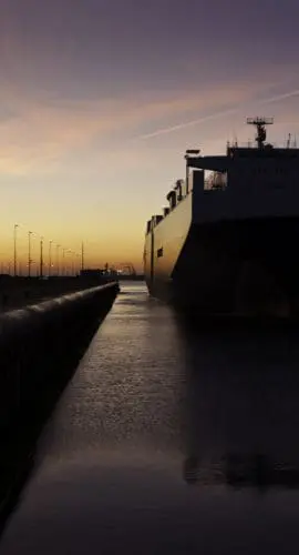 cargo ship mooring in lock