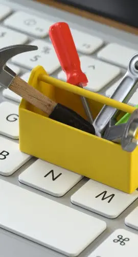 tools on the keyboard of a latop, 3d rendering,conceptual image. service  and support concepts.