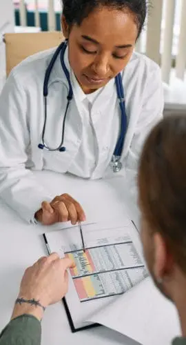 A medical practitioner showing a patient paper