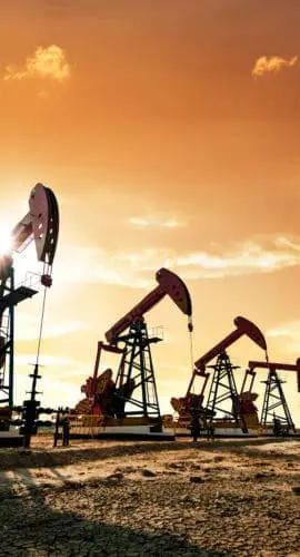Oil pumps working under the sunrise sky