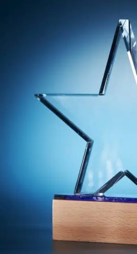 Glass trophy on blue background