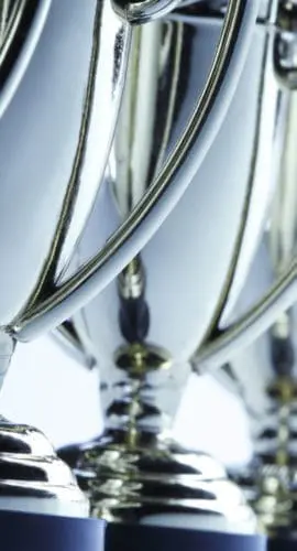 Close-up of a long row of trophies. Shot with shallow depth of field.