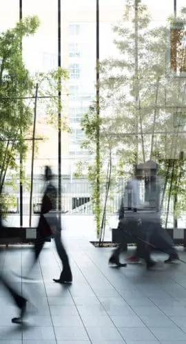 Business person walking in a urban building