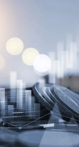 Blue double exposure of money coins stacking with bar graph for financial and investment business concept.