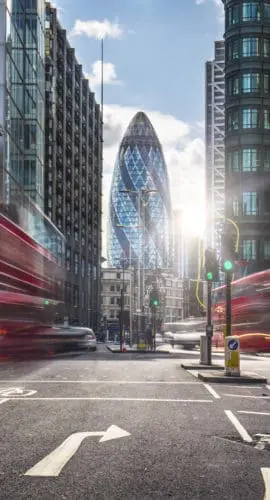 Buses on the street at the financial district of London.