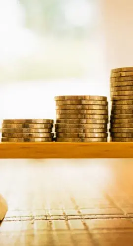 Coins stack with balance scale. Money management, financial plan, time value of money, business idea and Creative ideas for saving money concept.