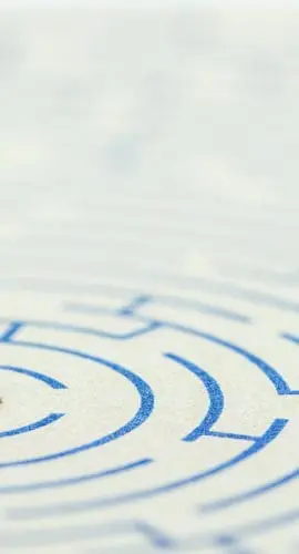 Reducing, removing or overcome financial barrier, financial concept : US dollar bag on a maze puzzle. The image depicting a situation how to overcome financial difficulties and avoid a financial distress.