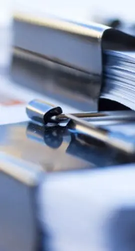 Piles of documents with black clip