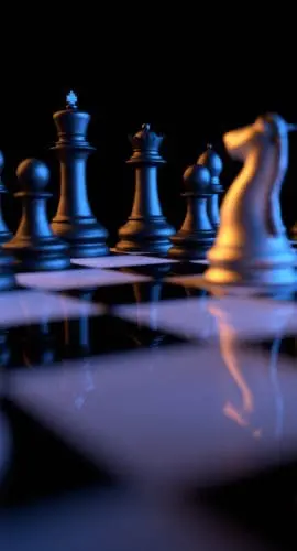 Close up of chessmen on chessboard with the focus on a queen