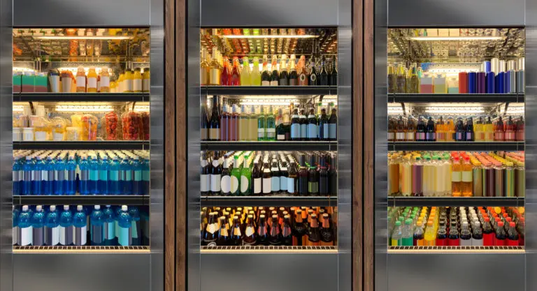 Glass door fridges photo mockup. Soda pop cans, vine and beer bottles in vertical freezer at airport restaurant.
Suitable for presenting new cans and bottles among many others.