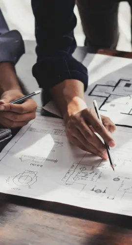 Civil engineer teams meeting working together wear worker helmets hardhat on construction site in modern city. Foreman industry project manager engineer teamwork. Asian industry professional team