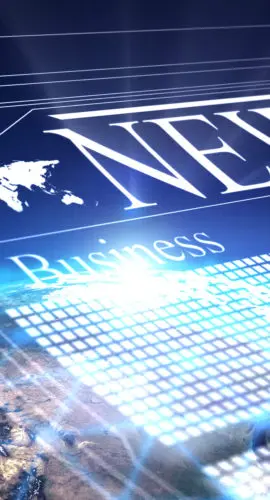 Stack of commercial real estate documents with glasses, pen, and calculator on wooden desk, symbolizing due diligence and contract analysis.