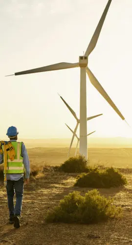 Engineer, wind turbine and clean energy with electricity and environment, sustainability and natural with technology. Renewable, engineering with agriculture, man and windmill inspection and mockup