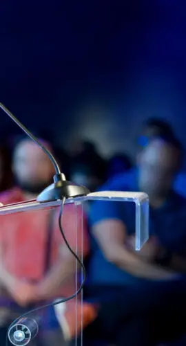Unrecognizable politician speaking at a political rally