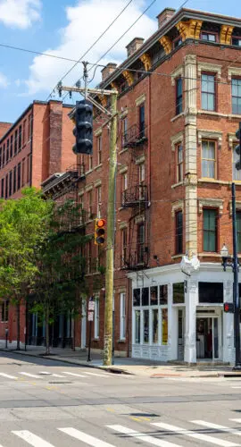 Cincinnati, Ohio, USA - Woman crossing street in Over-the-Rhine district