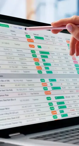 Woman At Office Computer Analyzing Medical Bills And Financial Data Carefully.