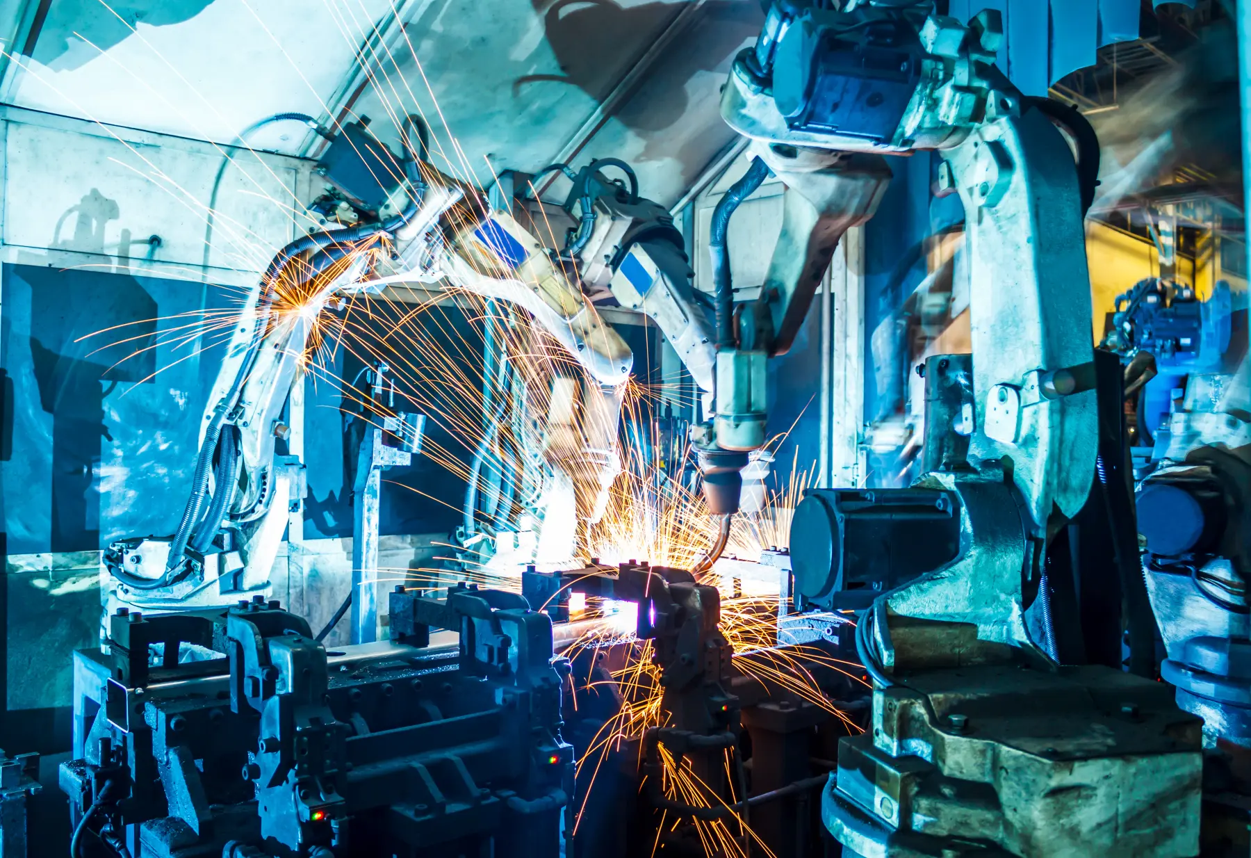 Robots welding in a car factory