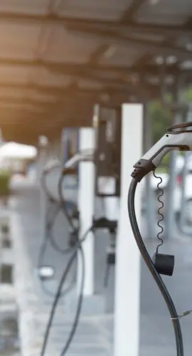 Electric car on electric car charging station. Power supply for electric car charging. Clean energy concept